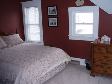 Queen size bed with a door opening to a balcony. New carpeting. Large walk in closet.