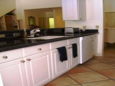Renovated kitchen with newer cabinets, granite counters and appliances