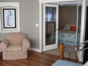 A private sitting room leads into the master bedroom and ensuite. The sitting room has a single daybed and a private outdoor entrance. 