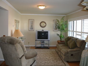 Living room is open to the dining area and kitchen.  Cable TV with DVD player.
