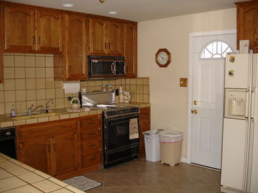 Kitchen is open to the dining area and is fully furnished