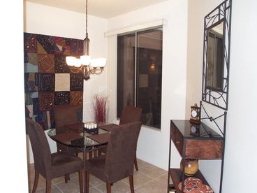 Dining area with view of courtyard and sunset