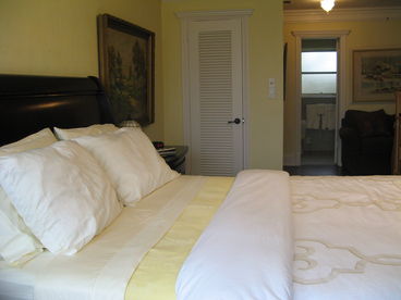Large master with view of en suite bathroom.