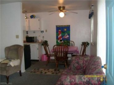 Full kitchen, sunny dining area and spacious living room.