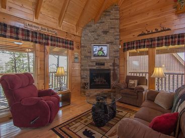 Living Room Features Stacked Stone Fireplace