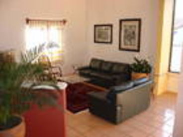 There is a large television with a DVD player  out of view.