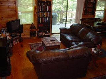 Enjoy the spacious living room with comfy leather furniture, gas fireplace, DIRECT TV, DVD and VCR  player, CDs, games and books galore for you to enjoy! Also unlimited long distance too!