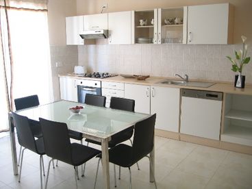 Equipped modern kitchen with air-condition and seating for 6 persons. 