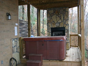 Relax in the hot tub while gazing into the glowing fire.