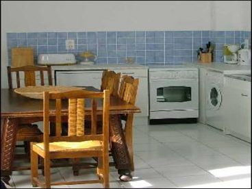 1st floor kitchen with table that expands to seat 10, washing machine, oven, percolator, microwave, toaster, etc.