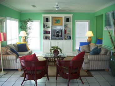 Open to dining for 14, kitchen with lots of counter space and broad porch perfect for relaxing and watching the sunset.