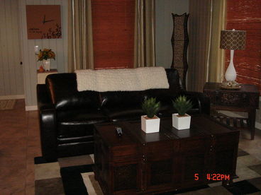 Living room on main floor with Queen Sofa bed & 42\