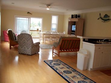 Large den with all new furniture and decor, color cable tv, balcony, beside kitchen