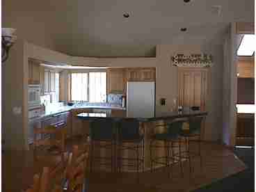 The Kitchen/Dining area has granite and tile countertops, solid oak floors, large dining room table and kitchen stools.  Appointed with all major and minor appliances, utensils, etc. 