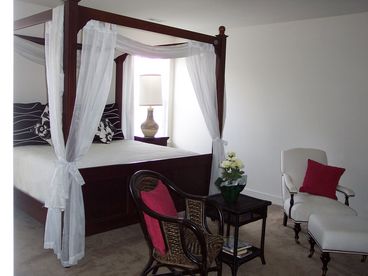 Master Bedroom with TV/sitting area and large luxurious master bath with oversize soaking tub and separate shower and double sinks