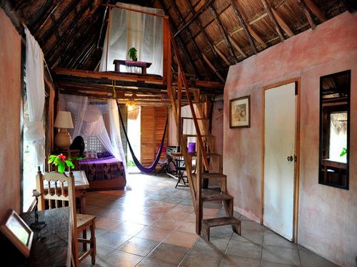 Room #4 - under a thatched roof - a large room with a fridge