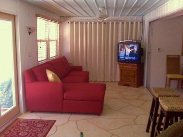 Living room which is right off the pool area has TV, DVD and VCR with queen size Sofa sleeper for guests..