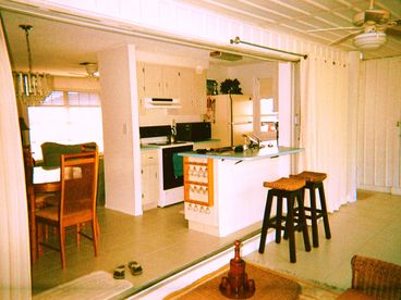Kitchen and bar area with laundry room off to the right side...