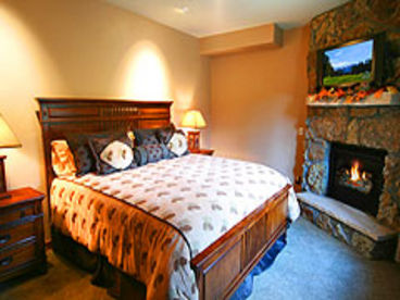 Beautiful grand master bedroom with king size bed and fireplace