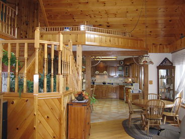 Beautiful Kitchen and Living area with windowns looking out at the lake.