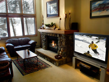 Gorgeous stone fireplace and flat screen TV