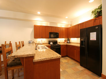 Open Kitchen with Beautiful Wood Cabinets