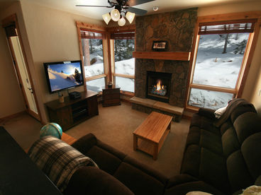 Fireplace Surrounded by Picture Windows