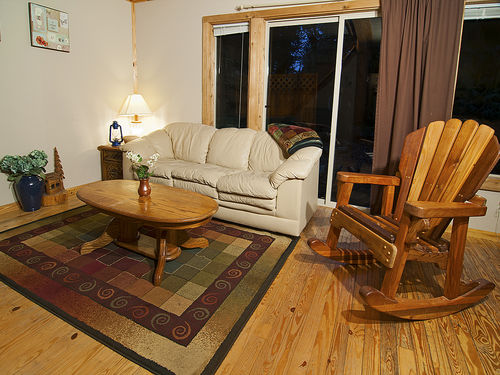 Cozy living room with glass slider to the hot tub and deck.