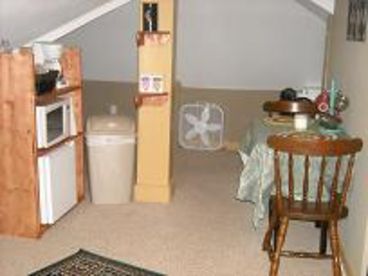 Loft kitchenette - features microwave, mini fridge, coffee pot, small dinette area, complimentary coffee, tea, hot chocolate, and apple cider.  Popcorn too!
