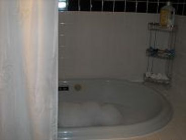 Huge Jacuzzi!! Room for two.  Jets are strong. 