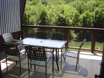 The Outdoor Dining area and Hot Tub overlook the river.