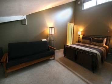 Upper bedroom with queen bed & queen futon