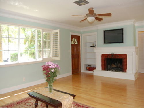 Living Room view of the wood burning fireplace and 42\