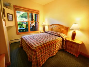 Guest room with queen bed and views