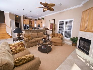 Great room with fireplace, stereo, flat screen TV, and private balcony.