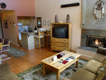 Living room with gas fireplace and TV