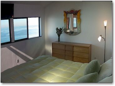 Listen to the waves from the master bedroom with king-size bed and flat screen tv.