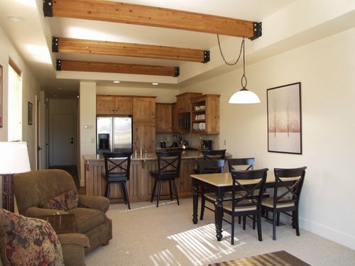 View from Living Room into Dining Area-Seating for 4-and Kitchen with Stainless Steel Applicances