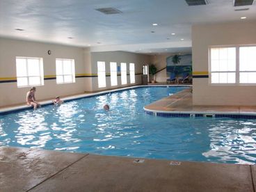 Big Indoor Pool/Hot Tub with lots of tables and chairs to sit back and relax.