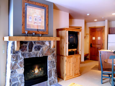 Warm & Cozy Stone Fireplace & TV