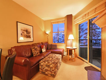 Living room complete with leather sofa 