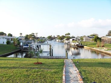 Imagine sitting on the back patio with this view, or see it through the windows from the living room. Bring your boat our new 10K LB lift is ready to use. Water and electric at dock.