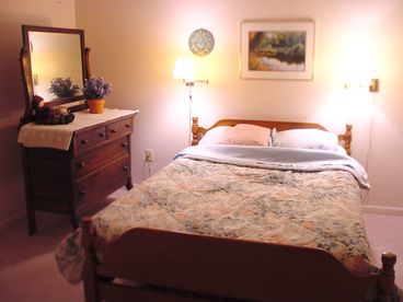 Comfortable and private master bedroom on the main floor with 2 dressers and large closet.