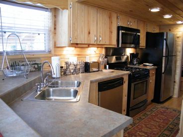Full kitchen, complete with dishwasher, oven, stove, microwave, and full refrigerator.  All brand new, stainless steel appliances.