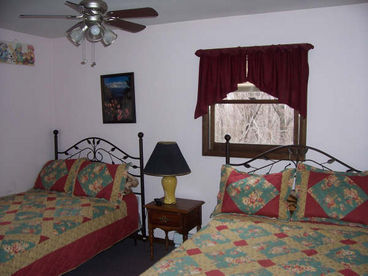 Bedroom with all the amenities including dresser and television