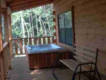 Sit in the relaxing Hot Tub and enjoy the mountain view.