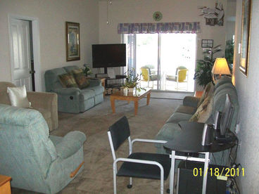 Living Room with computer and pool view