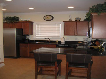 Full stocked kitchen with stainless appliances and granite countertops
