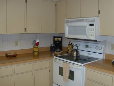 Fully-equipped all-electric Kitchen with dishes, pots and pans, eating utensils, etc.