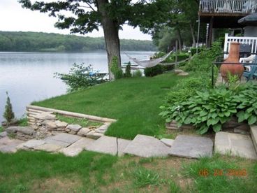 Stairs leading to lake from patio and deck